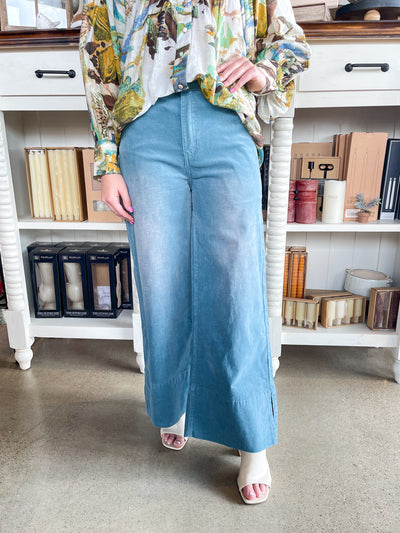 blue corduroy wide leg pants with belt loops and button closure 