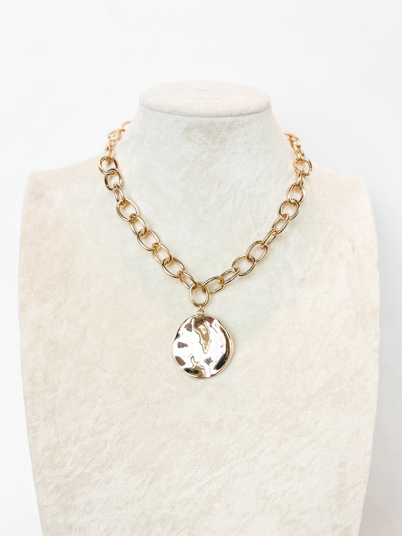 gold chain link necklace with hammered circle pendant 