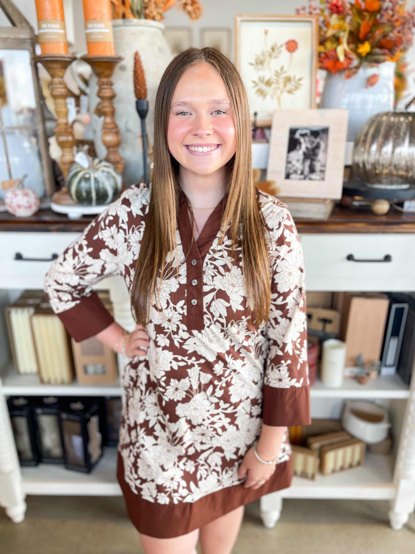 brown and white floral long sleeve dress with collar and button details