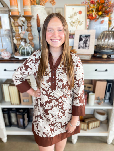 brown and white floral long sleeve dress with collar and button details