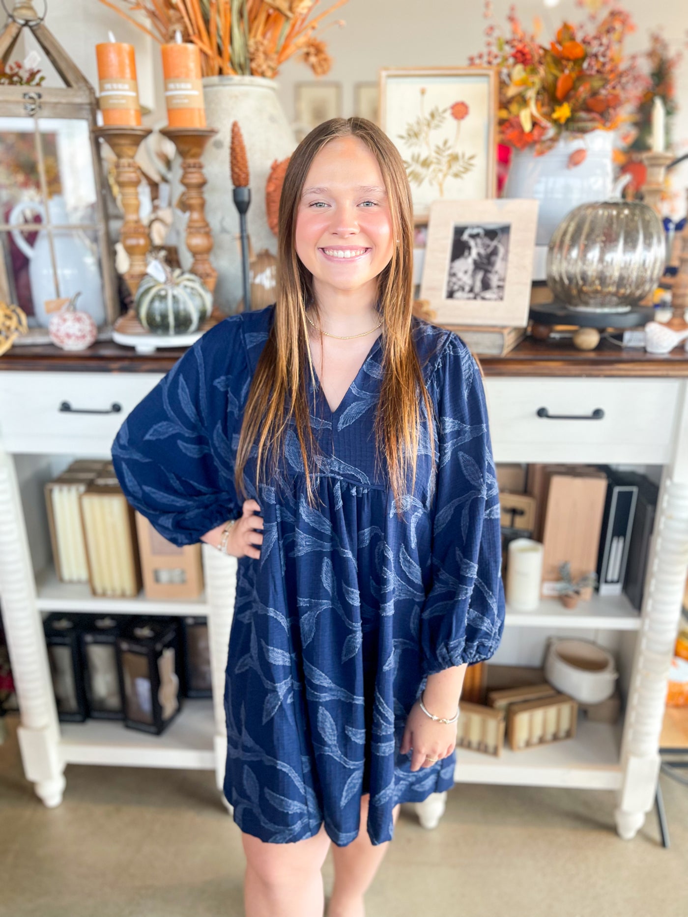 navy blue long sleeve dress with textured flower detail all throughout 