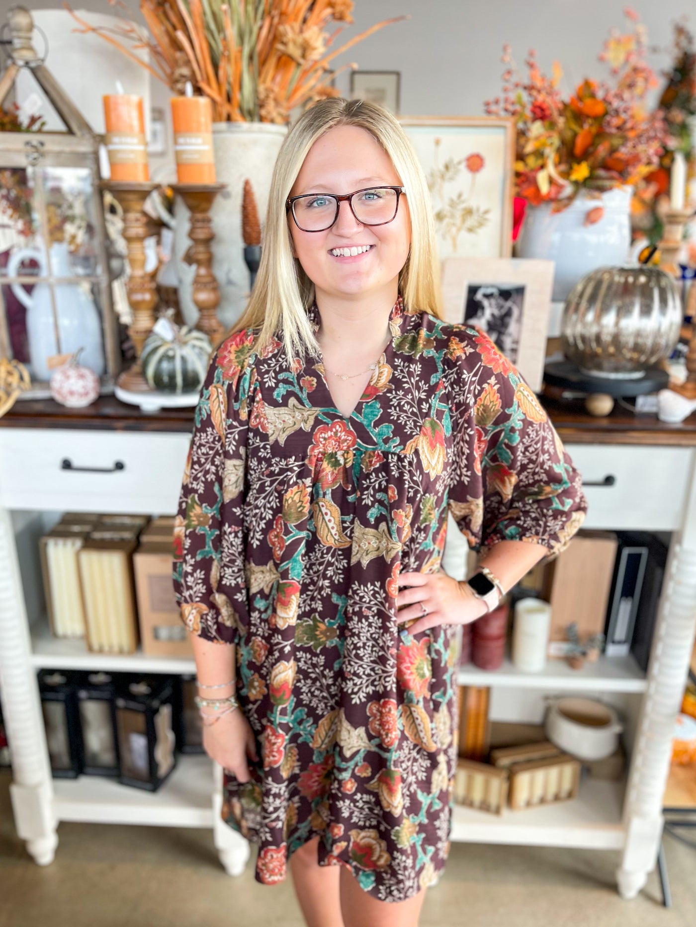 vibrant and colorful brown floral pattern dress with long sleeves and v-neckline
