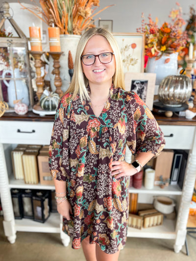 vibrant and colorful brown floral pattern dress with long sleeves and v-neckline
