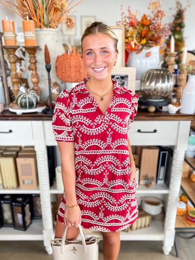 red and white patterned short-sleeve dress with eyelet details and collar 