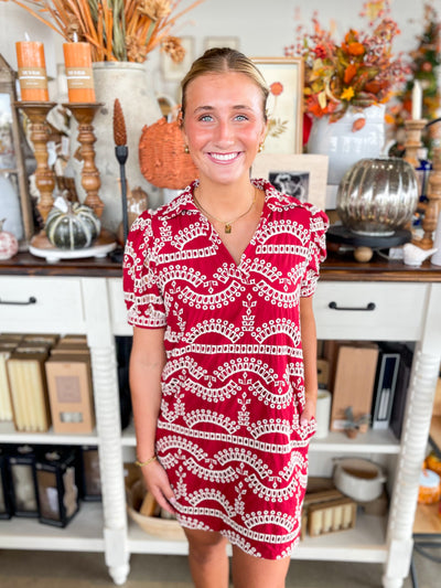 red dress with white eyelet details and collar with short sleeve 