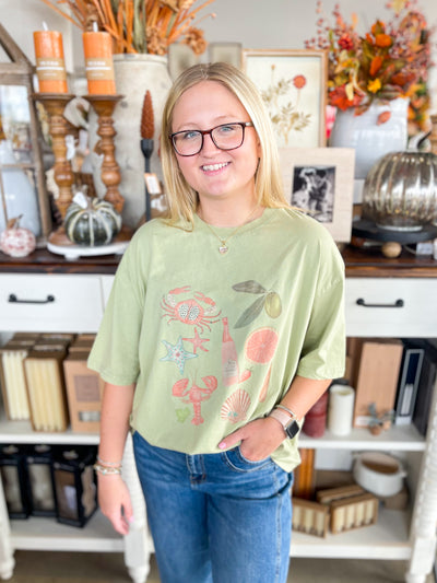 beach and summer themed sage green graphic tee 