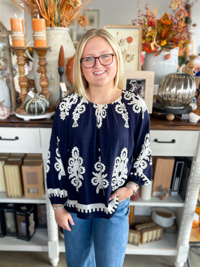 navy and cream printed top with scoop neck and long sleeves 