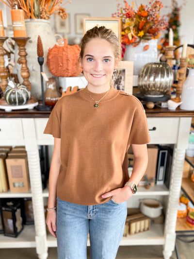 solid brown fitted sweater with gold buttons on shoulder 