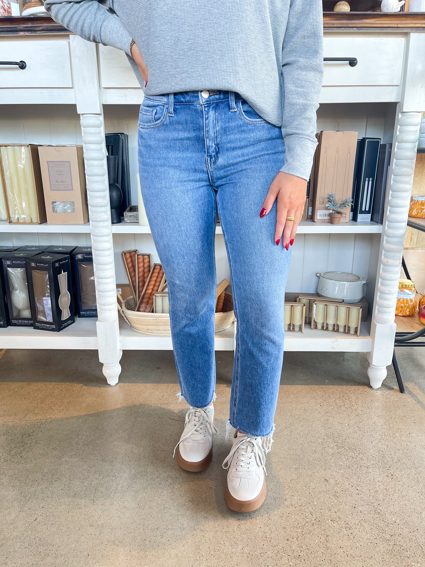 medium wash cropped slight flare jean with raw hem 